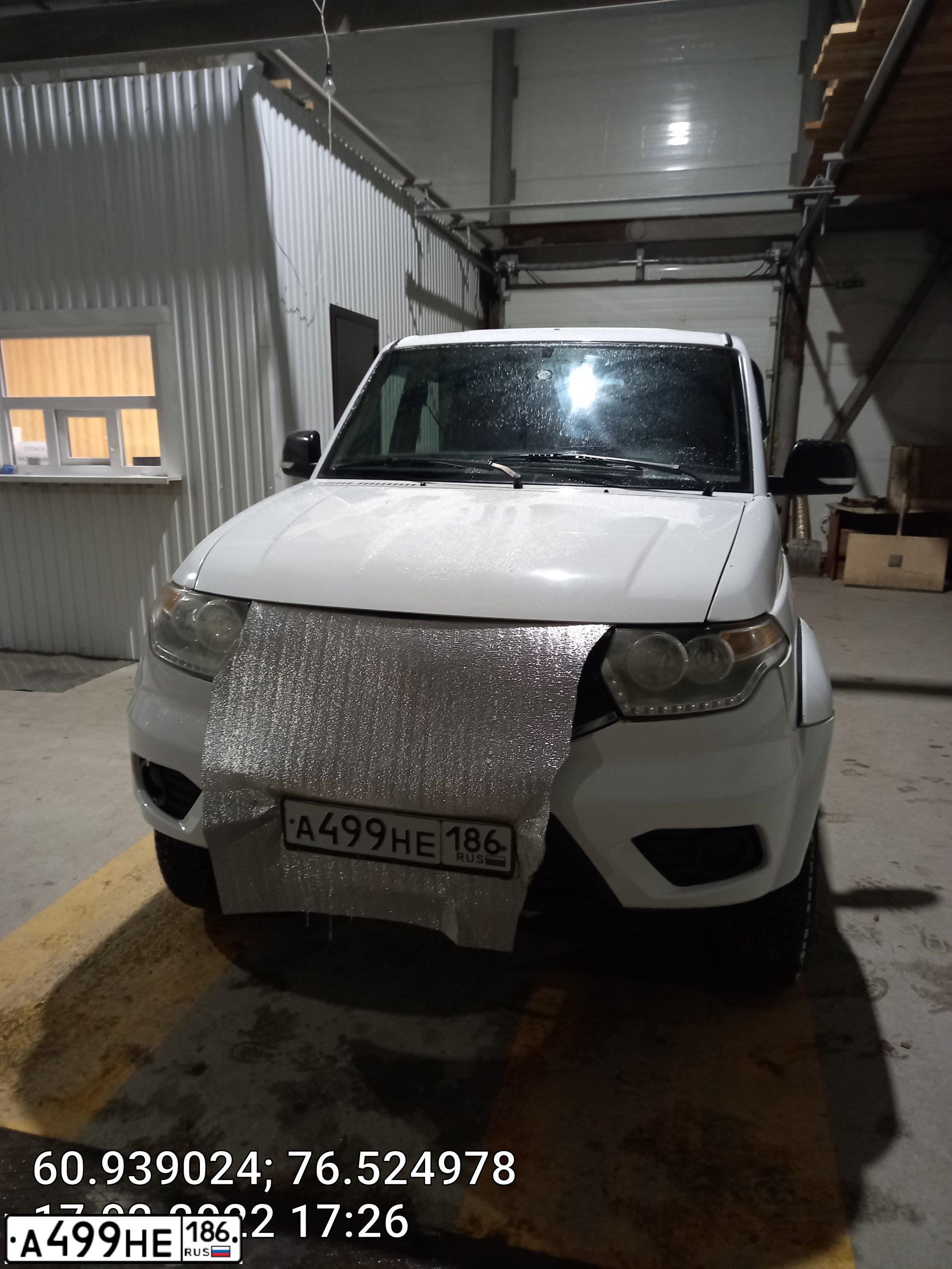 Фото автомобиля UAZ 2363 PICKUP, 2017 — госномер А499НЕ186. Цвет: Белый НЕМЕТАЛЛИК