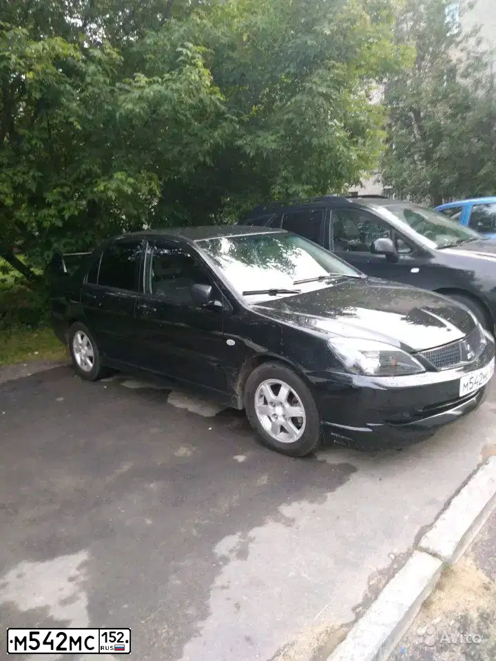 Фото автомобиля MITSUBISHI LANCER, 2004 — госномер М542МС152. Цвет: ЧЕРНЫЙ