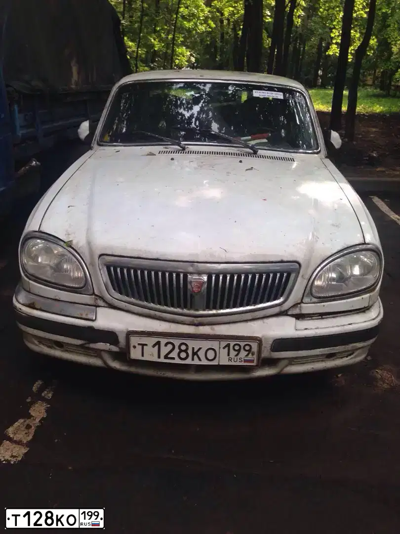 Фото автомобиля GAZ 3110 WOLGA, 2005 — госномер Т128КО199. Цвет: Белый