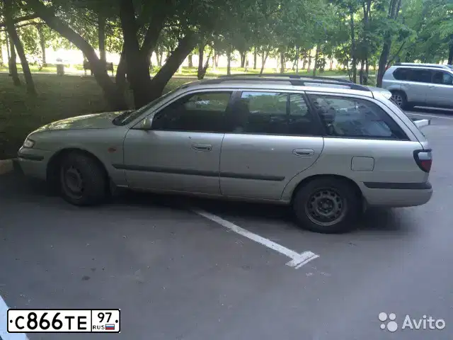 Фото автомобиля MAZDA 626, 1999 — госномер С866ТЕ97. Цвет: ЗОЛОТИСТЫЙ