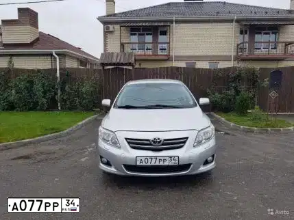 Фото автомобиля TOYOTA COROLLA, 2007 — госномер А077РР34. Цвет: Серебристый