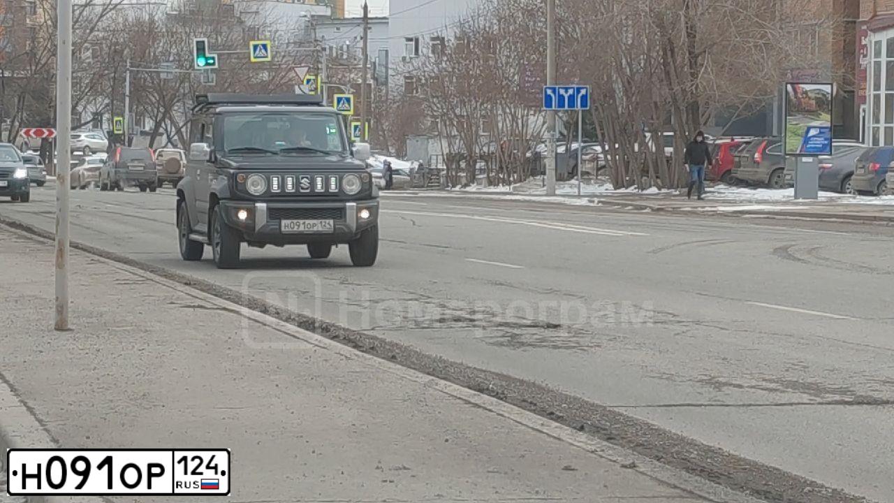 Фото автомобиля SUZUKI JIMNY, 2019 — госномер Н091ОР124. Цвет: ЧЕРНЫЙ