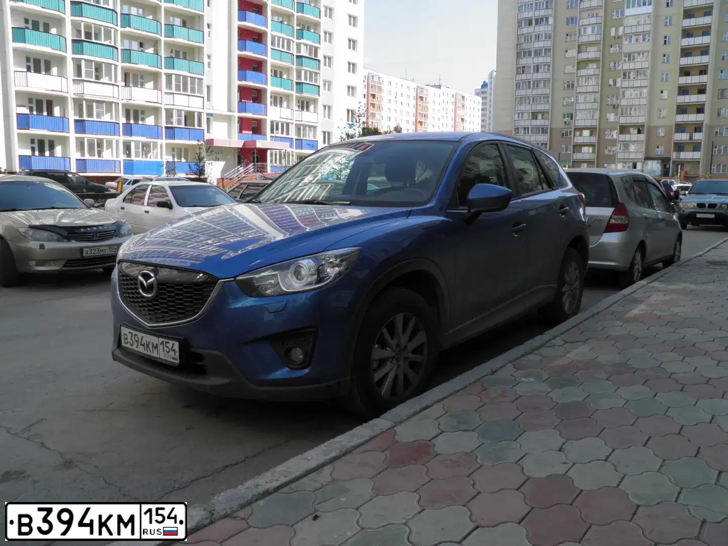 Фото автомобиля MAZDA CX-5, 2012 — госномер В394КМ154. Цвет: СИНИЙ