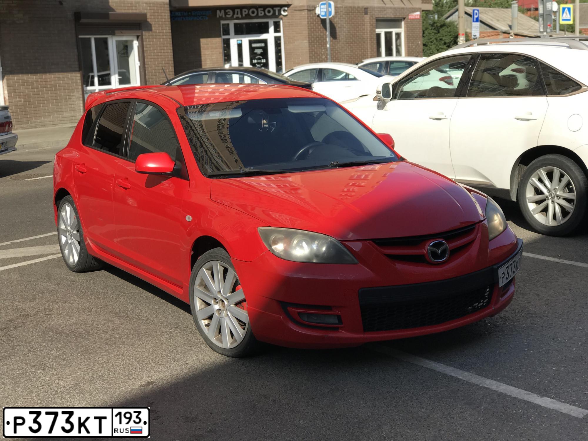 Фото автомобиля MAZDA 3, 2007 — госномер К007ОР62. Цвет: Красный