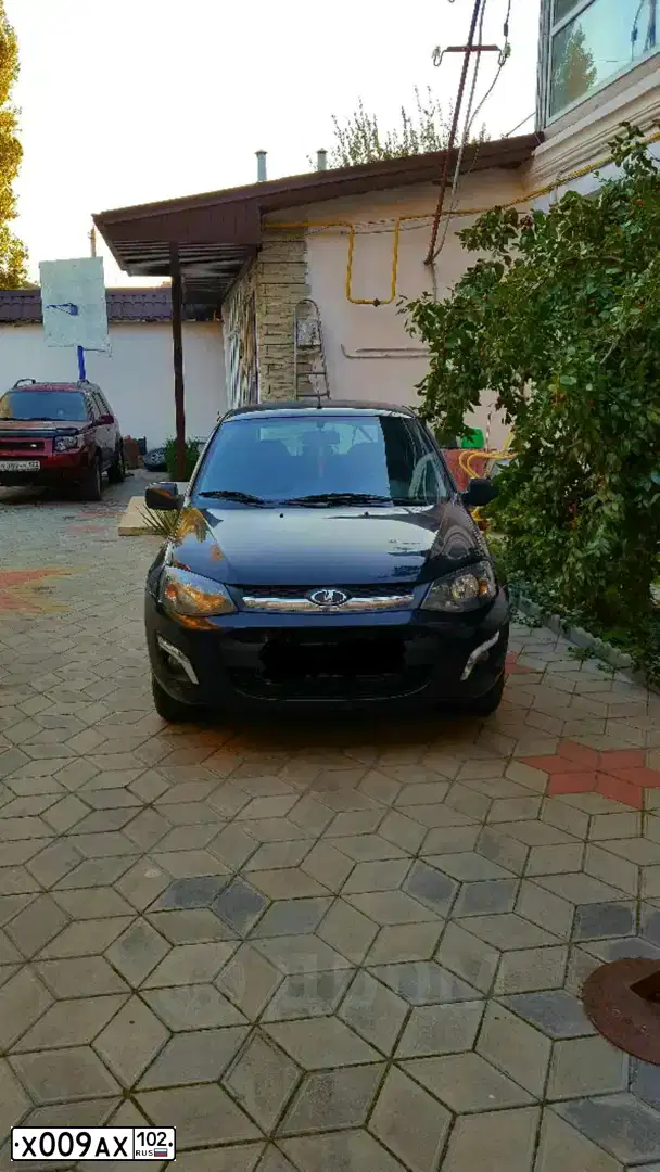 Фото автомобиля LADA LARGUS, 2018 — госномер Х009АХ102. Цвет: ЧЕРНЫЙ