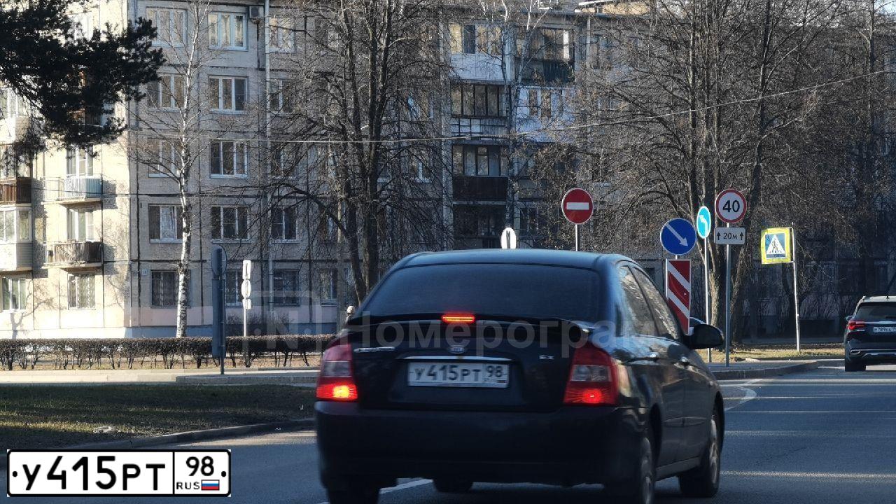 Фото автомобиля KIA CERATO, 2006 — госномер У415РТ98. Цвет: ЧЕРНЫЙ
