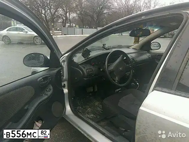 Фото автомобиля DODGE NEON, 2001 — госномер В556МС82. Цвет: СЕРЕБРИСТЫЙ