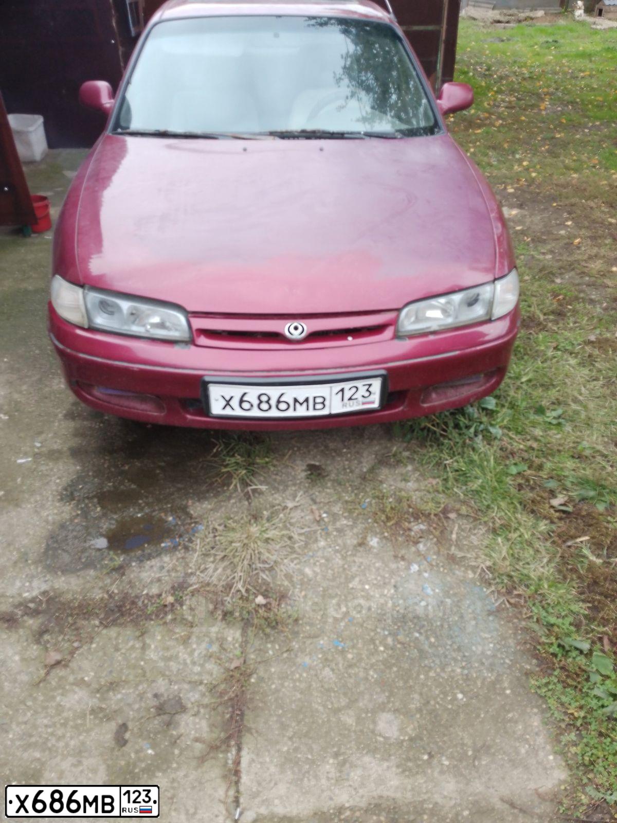 Фото автомобиля MAZDA 626, 1994 — госномер Х686МВ123. Цвет: Красный
