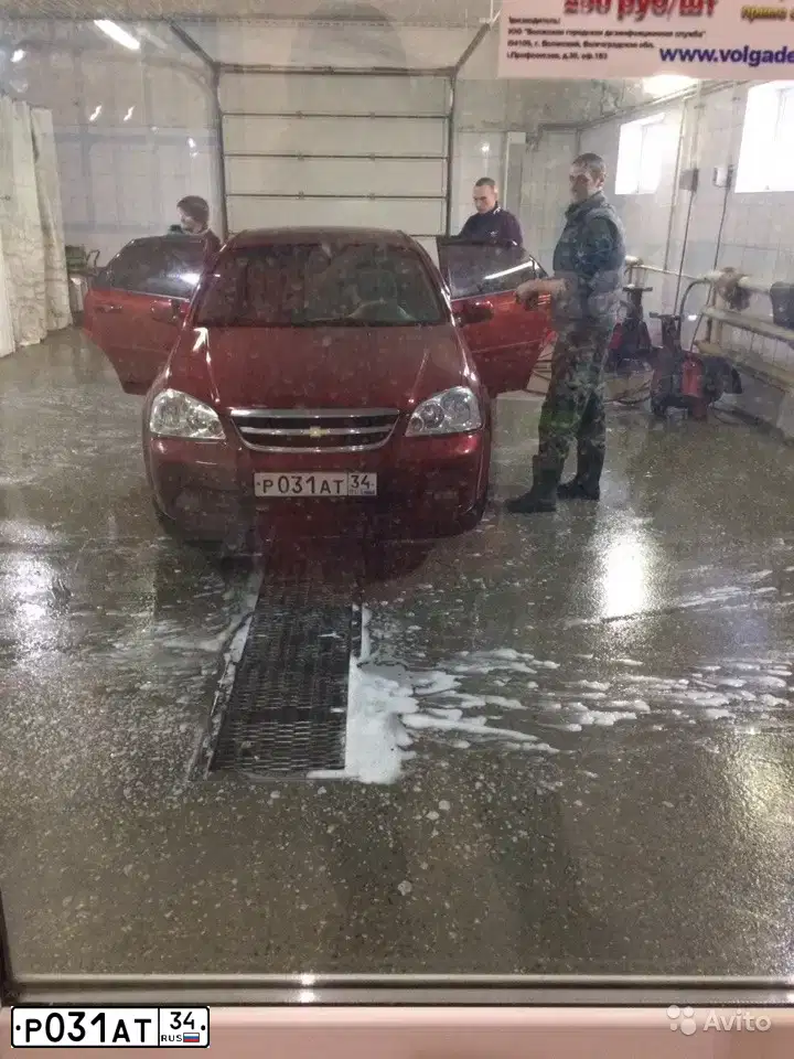 Фото автомобиля CHEVROLET LACETTI, 2009 — госномер Р031АТ34. Цвет: Красный