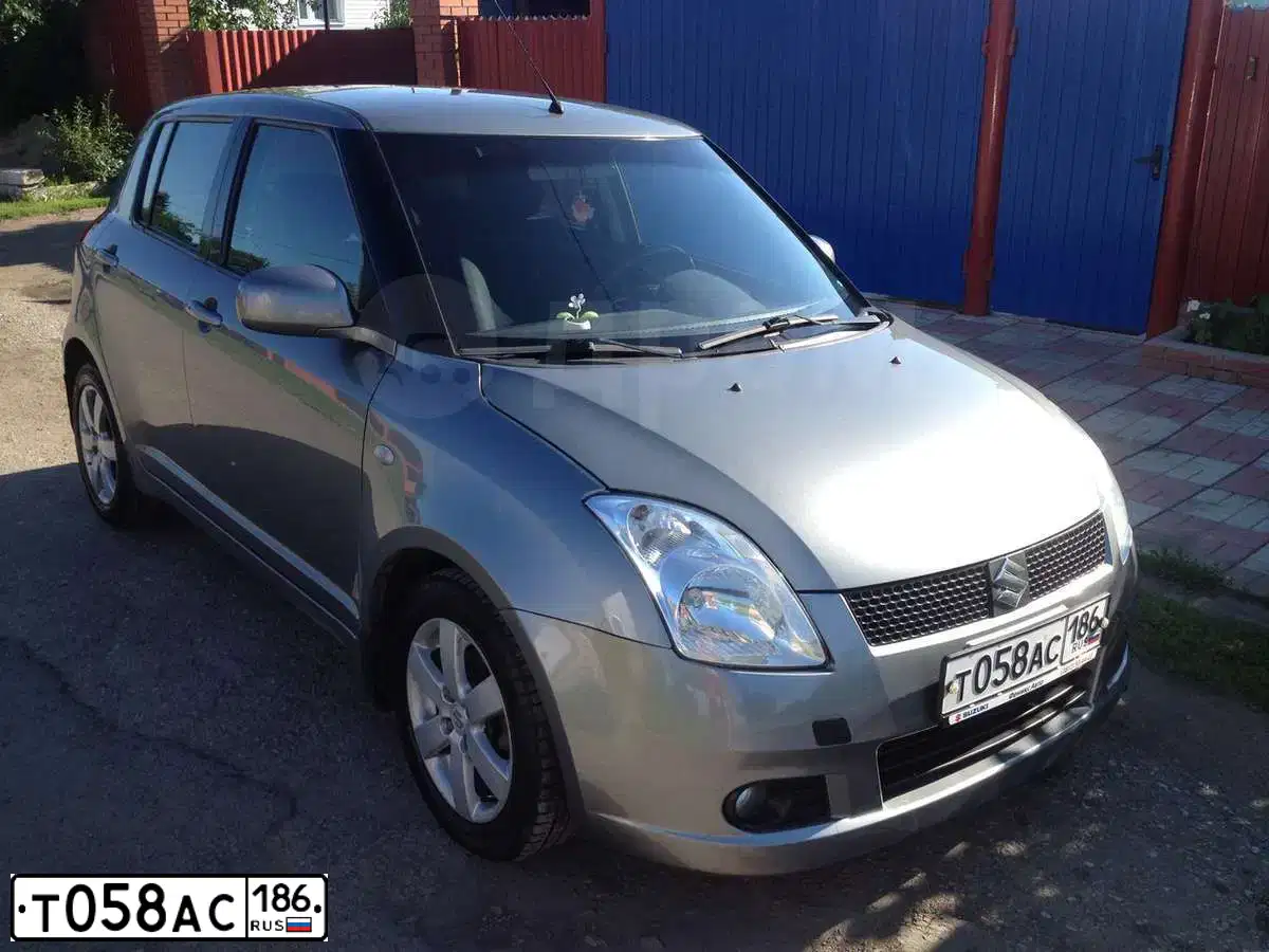 Фото автомобиля SUZUKI SWIFT, 2008 — госномер Т058АС186. Цвет: СЕРЫЙ