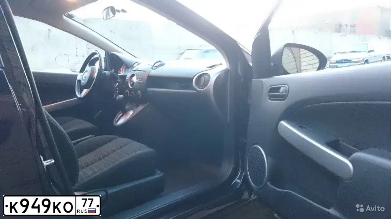 Фото автомобиля MAZDA 2, 2008 — госномер К949КО77. Цвет: ТЕМНО-ВИШНЕВЫЙ
