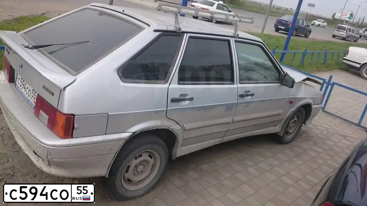 Фото автомобиля LADA 2114 SAMARA, 2013 — госномер С594СО55. Цвет: СВЕТЛО-СЕРЕБРИСТЫЙ МЕТАЛЛ