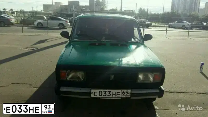 Фото автомобиля LADA 2190 GRANTA, 2012 — госномер Е033НЕ93. Цвет: Серебристый