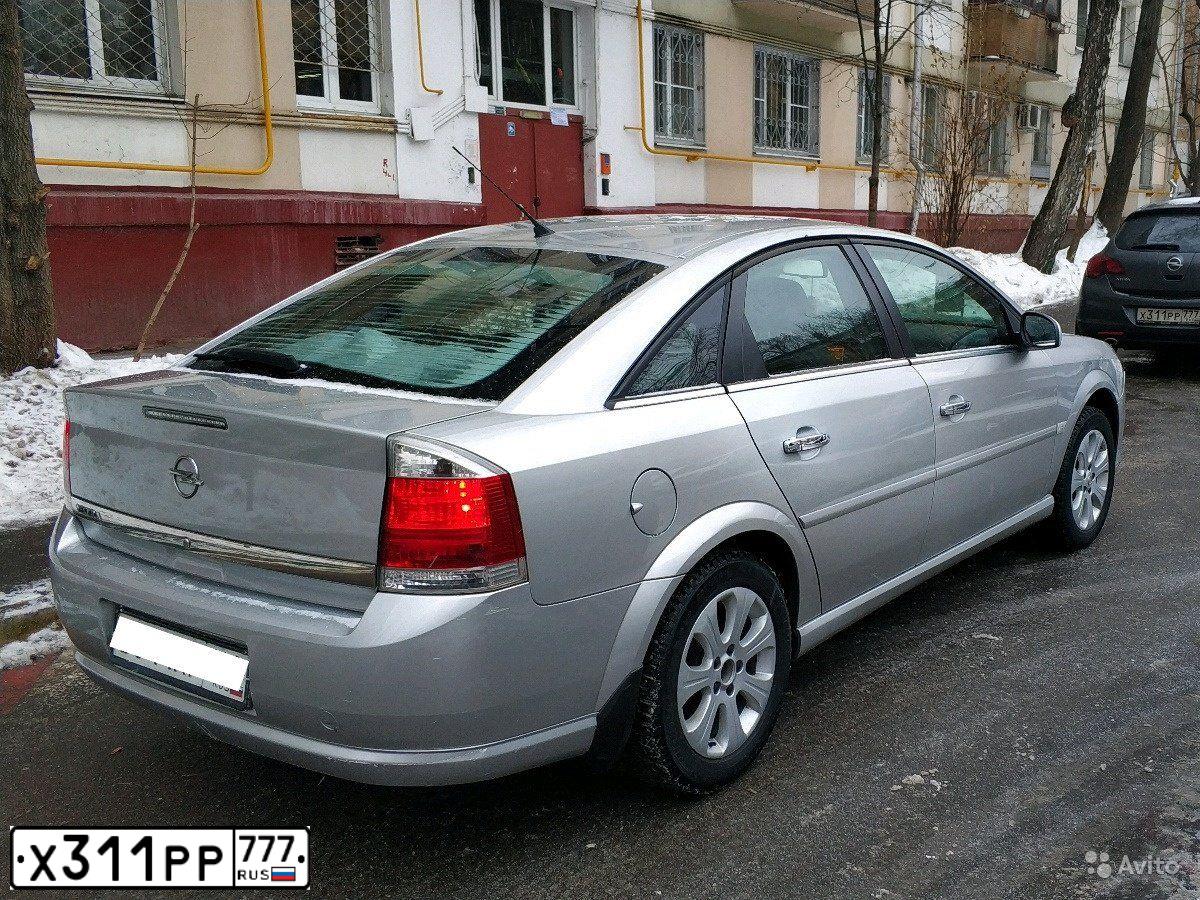 Фото автомобиля OPEL ASTRA, 2011 — госномер Х311РР777. Цвет: СЕРЫЙ МЕТАЛЛИК