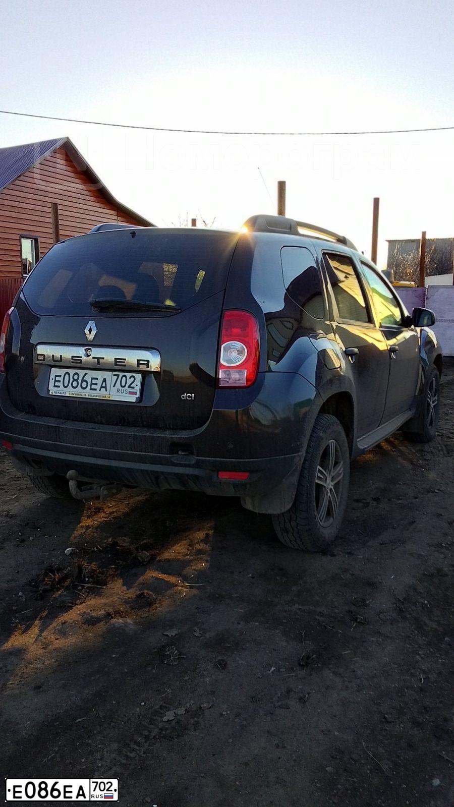 Фото автомобиля RENAULT DUSTER, 2014 — госномер Е086ЕА702. Цвет: ТЕМНО-КОРИЧНЕВЫЙ