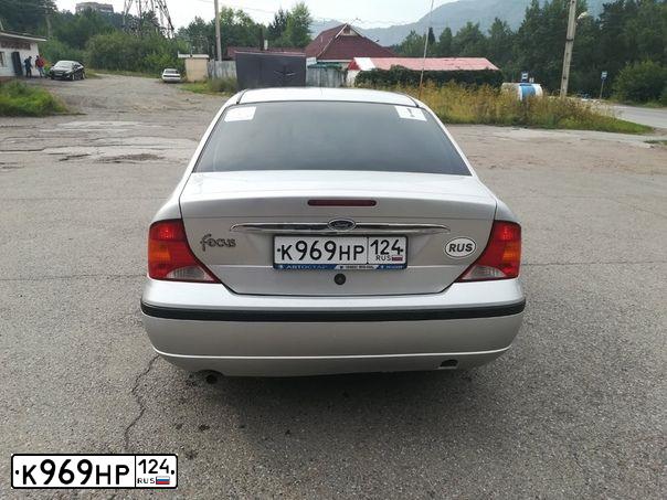 Фото автомобиля FORD D FOCUS, 2005 — госномер К969НР124. Цвет: серебристый