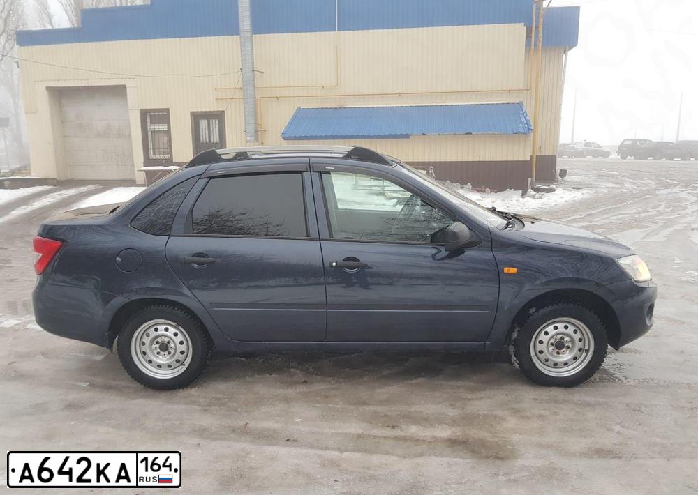 Фото автомобиля LADA 2190 GRANTA, 2012 — госномер А642КА164. Цвет: СЕРО-СИНИЙ