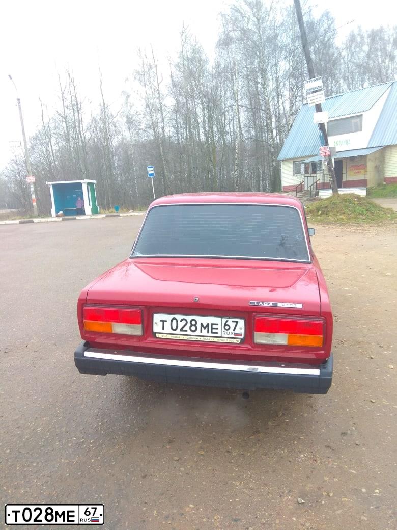 Фото автомобиля LADA 2107 LADA, 2006 — госномер Т028МЕ67. Цвет: ВИШНЕВЫЙ