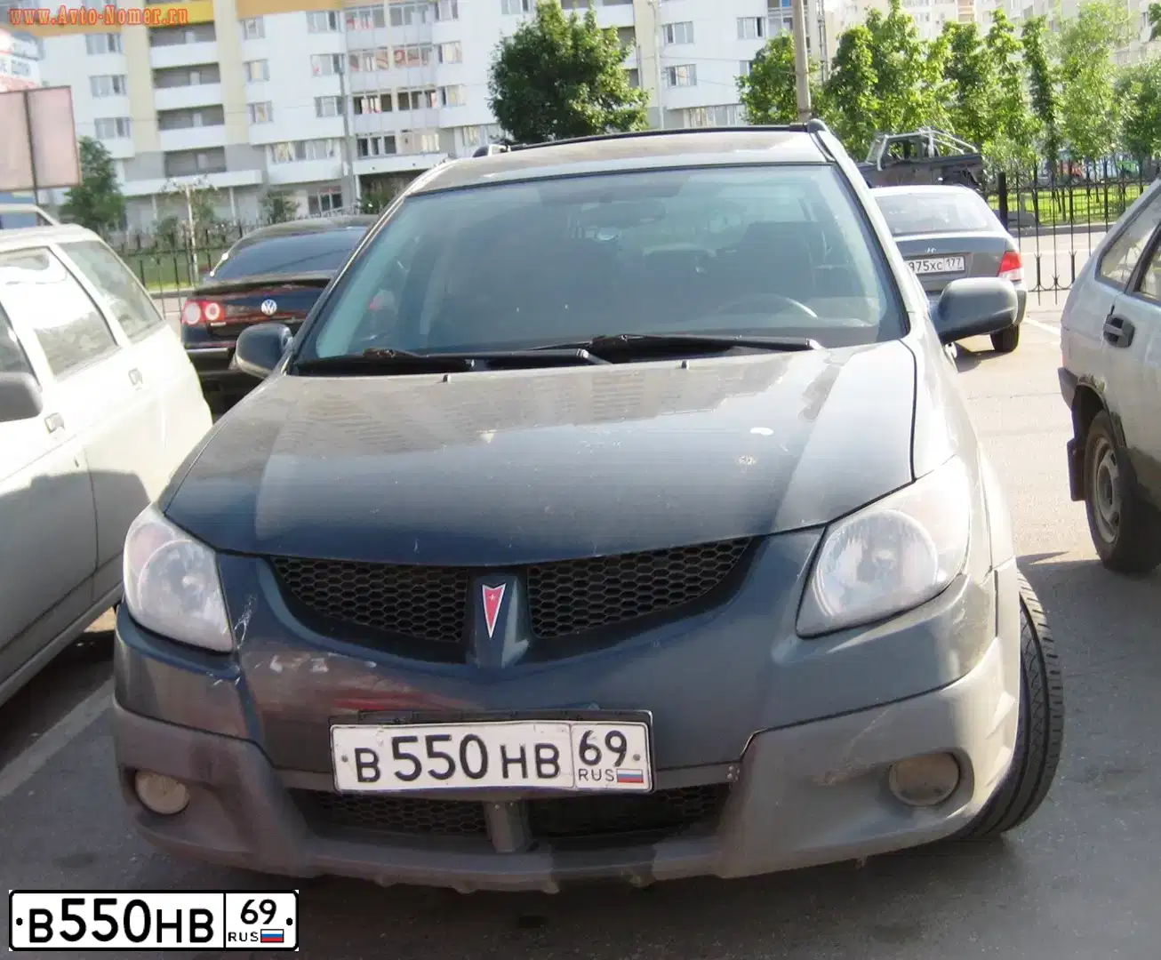 Фото автомобиля PONTIAC VIBE, 2002 — госномер Р317СО70. Цвет: ЧЕРНЫЙ