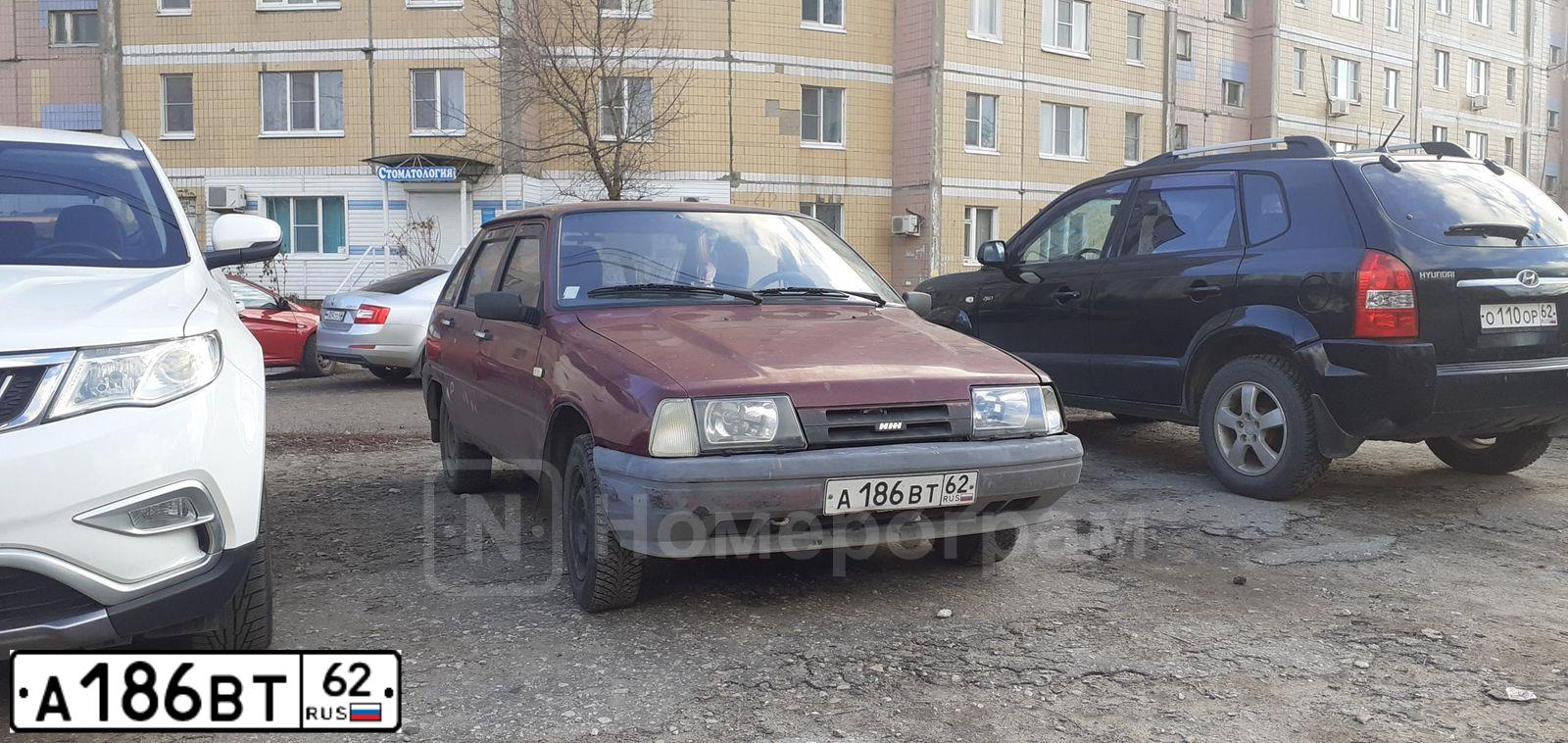 Фото автомобиля IZH 2126, 2002 — госномер А186ВТ62. Цвет: КРАСНЫЙ ГРАНАТ
