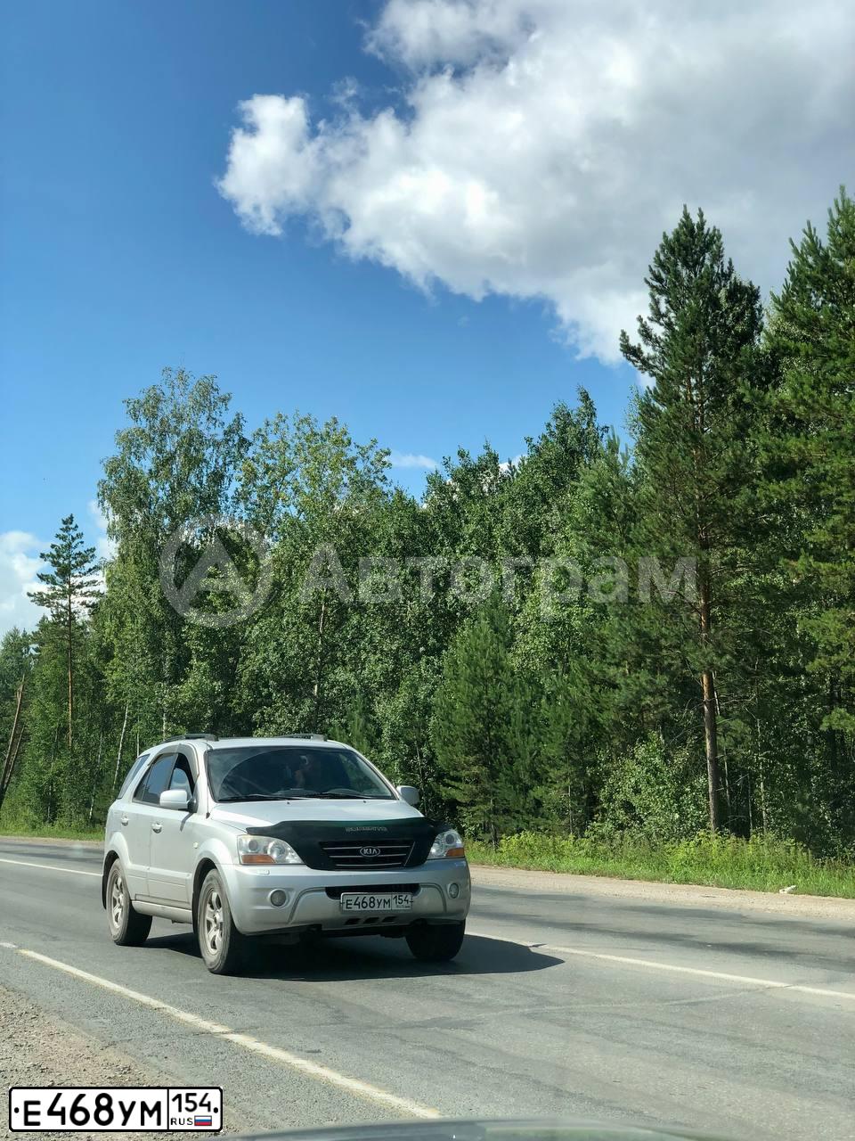 Фото автомобиля KIA SORENTO, 2008 — госномер К002ОХ72. Цвет: ЯРКО-БЕЛЫЙ