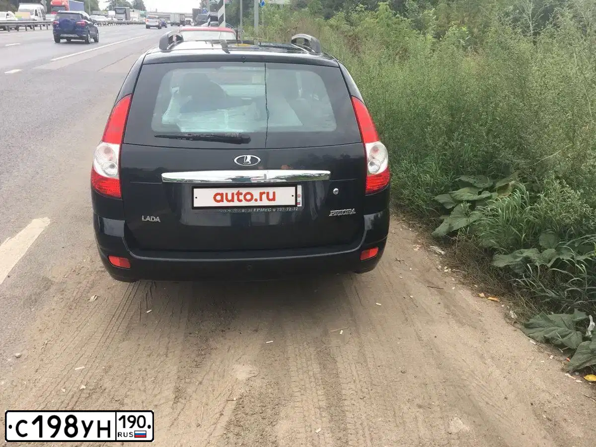 Фото автомобиля LADA 2171 PRIORA, 2012 — госномер Н455ВР40. Цвет: СИНЕ-ЧЕРНЫЙ
