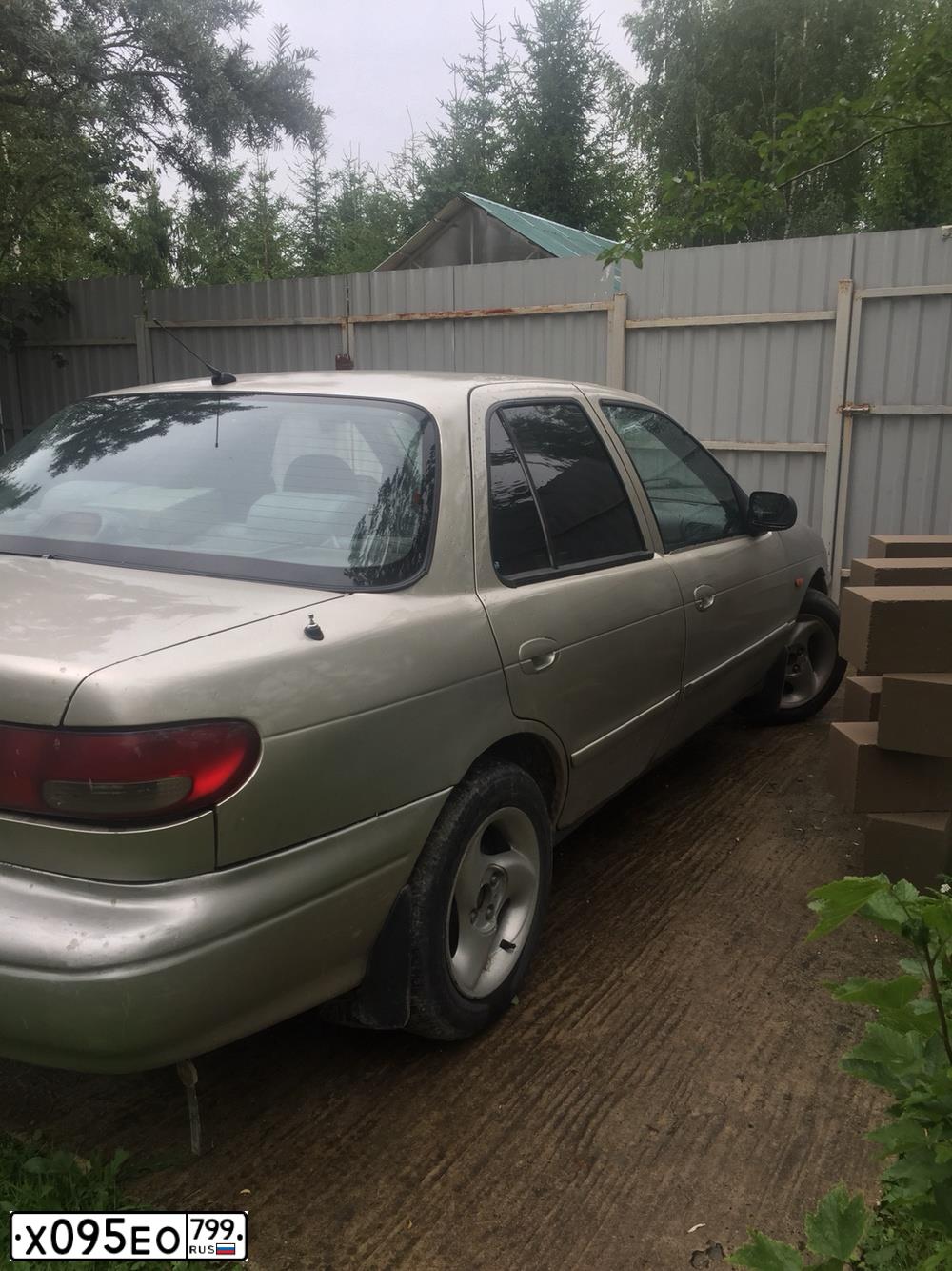 Фото автомобиля KIA SEPHIA, 1998 — госномер Н539НА46. Цвет: СЕРО ЗОЛОТИСТЫЙ