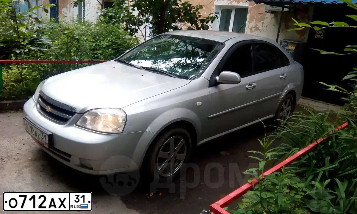 Фото автомобиля MITSUBISHI ASX, 2010 — госномер О712АХ31. Цвет: БЕЛЫЙ