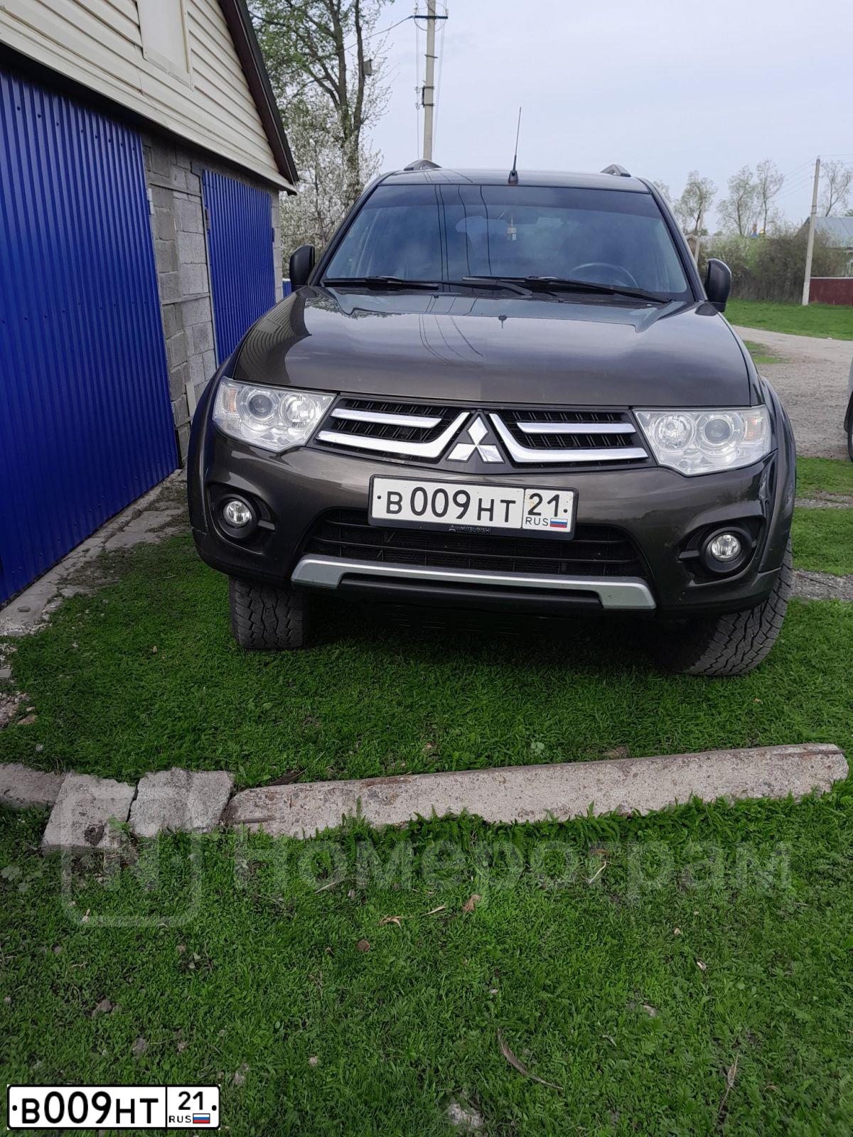 Фото автомобиля MITSUBISHI PAJERO SPORT, 2014 — госномер В009НТ21. Цвет: Коричневый