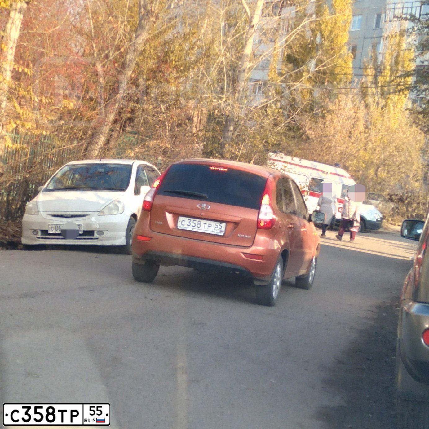 Фото автомобиля LADA KALINA, 2013 — госномер А952НС155. Цвет: Оранжевый