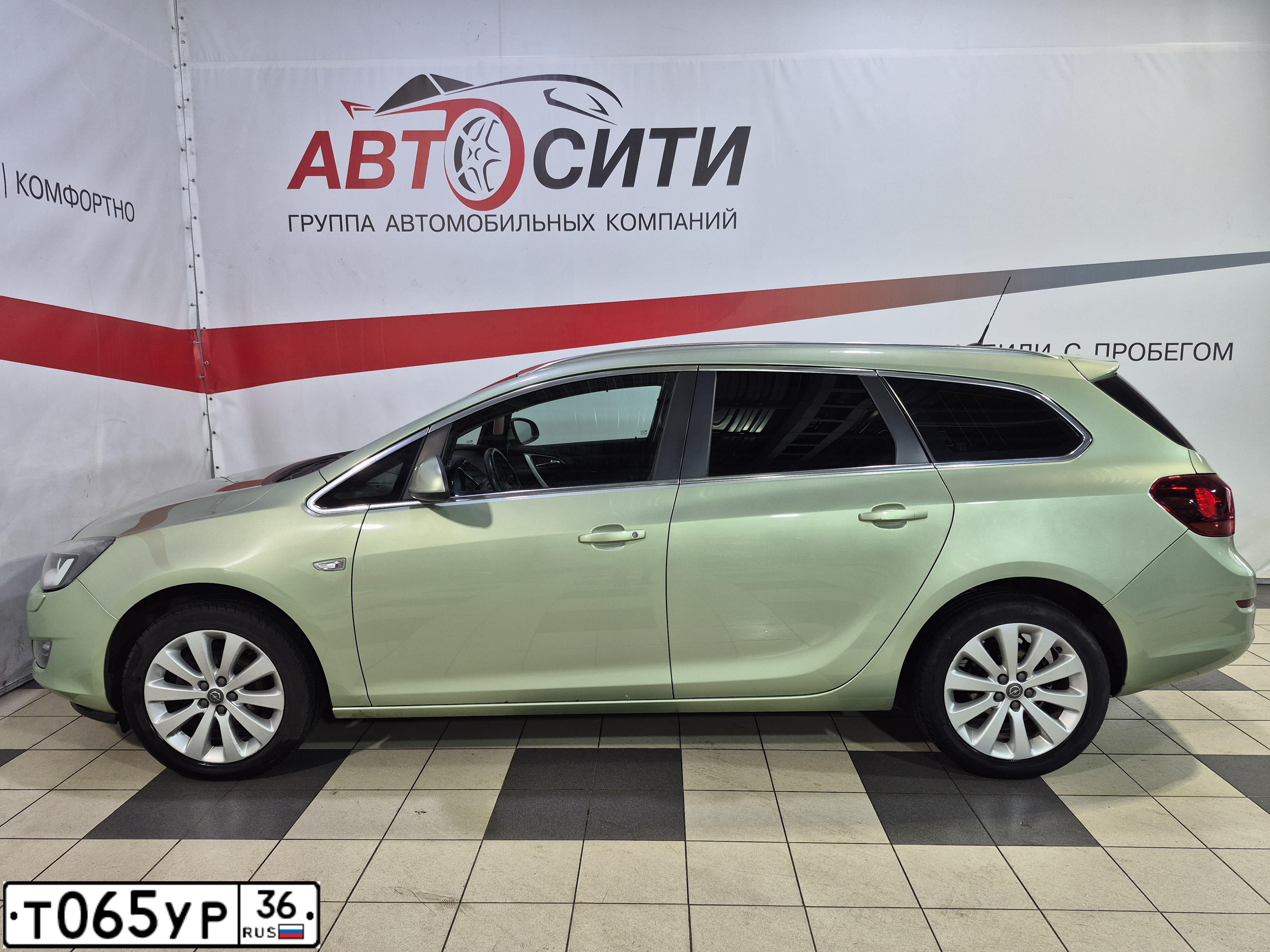 Фото автомобиля OPEL ASTRA, 2012 — госномер Т065УР36. Цвет: СЕРО-ЗЕЛЕНЫЙ