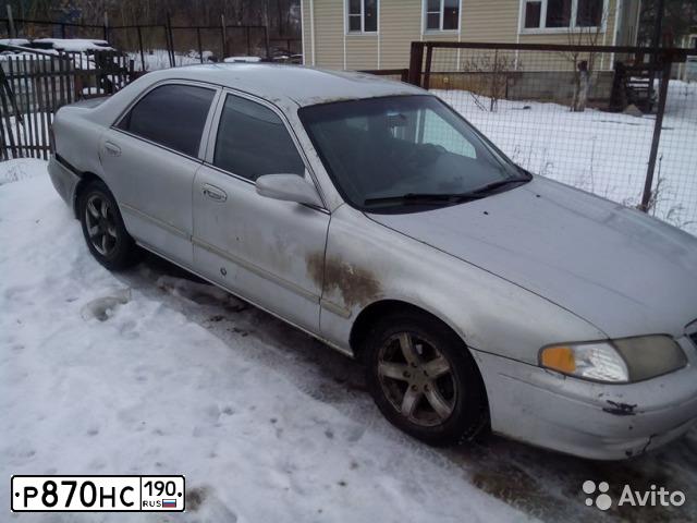 Фото автомобиля MAZDA 626, 2001 — госномер О828СМ33. Цвет: СЕРЫЙ