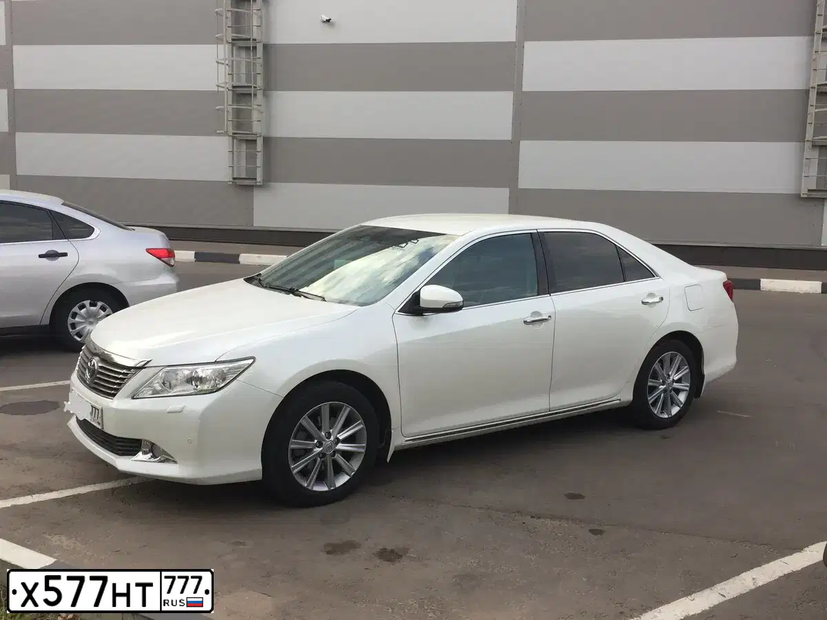 Фото автомобиля TOYOTA CAMRY, 2015 — госномер Х577НТ777. Цвет: ЧЕРНЫЙ МЕТАЛЛИК