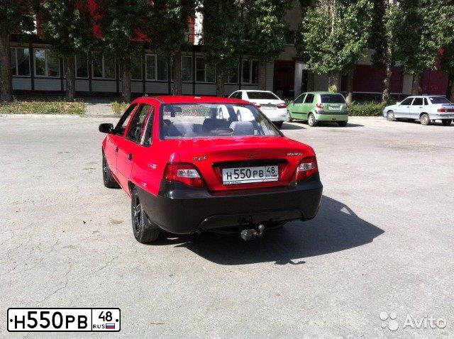 Фото автомобиля DAEWOO NEXIA, 2012 — госномер А574АР57. Цвет: ЯРКО-КРАСНЫЙ