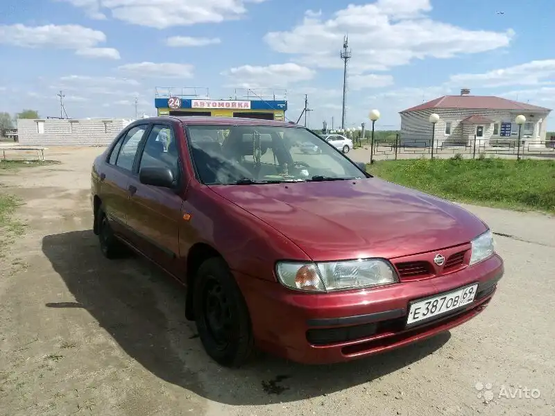 Фото автомобиля NISSAN ALMERA, 1997 — госномер Т752ТН69. Цвет: Красный