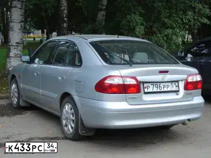 Фото автомобиля SKODA OCTAVIA, 2007 — госномер К136ВЕ136. Цвет: ЧЕРНЫЙ