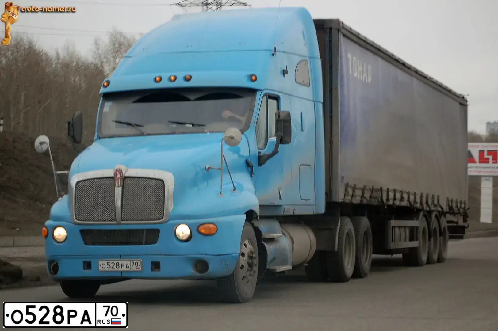 Фото автомобиля KENWORTH H T-SERIE, 1999 — госномер К967МС70. Цвет: ГОЛУБОЙ