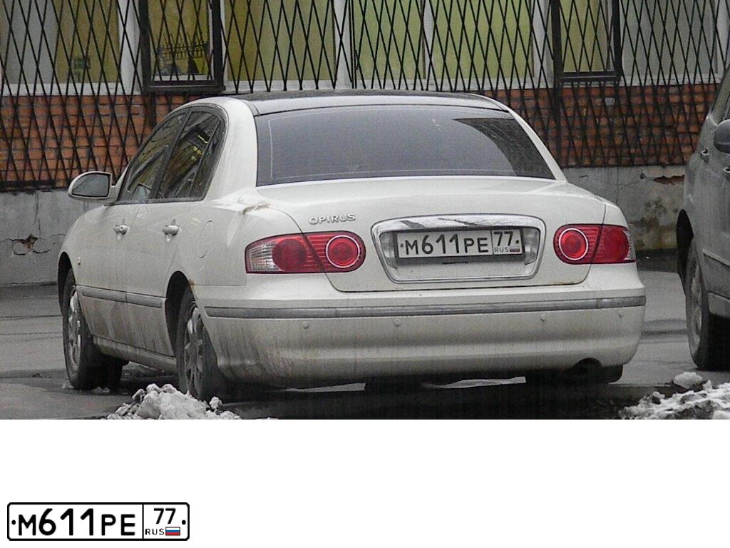 Фото автомобиля KIA OPIRUS, 2006 — госномер М611РЕ77. Цвет: БЕЛЫЙ
