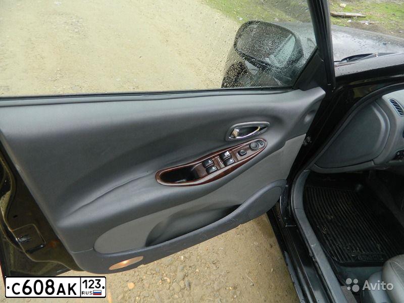 Фото автомобиля DAEWOO LEGANZA, 1998 — госномер Е920НМ03. Цвет: ЧЕРНЫЙ