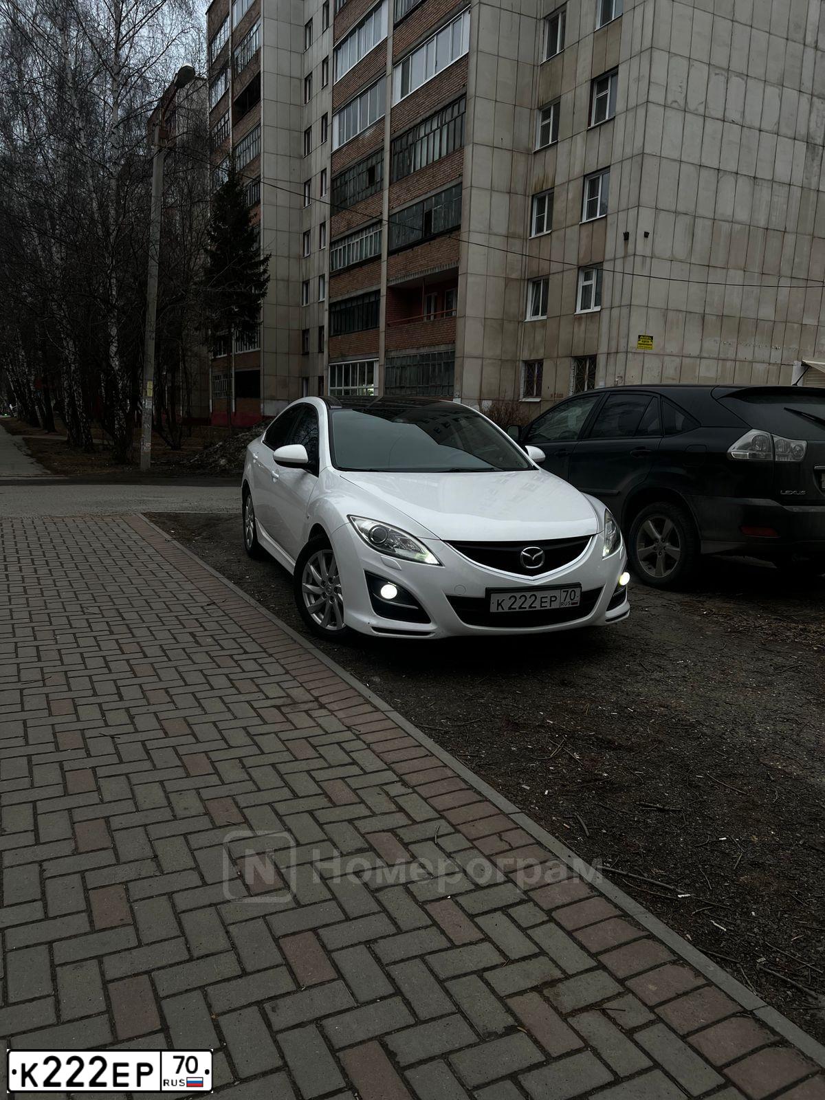 Фото автомобиля LADA 2172 PRIORA, 2010 — госномер К222ЕР70. Цвет: ЧЕРНЫЙ
