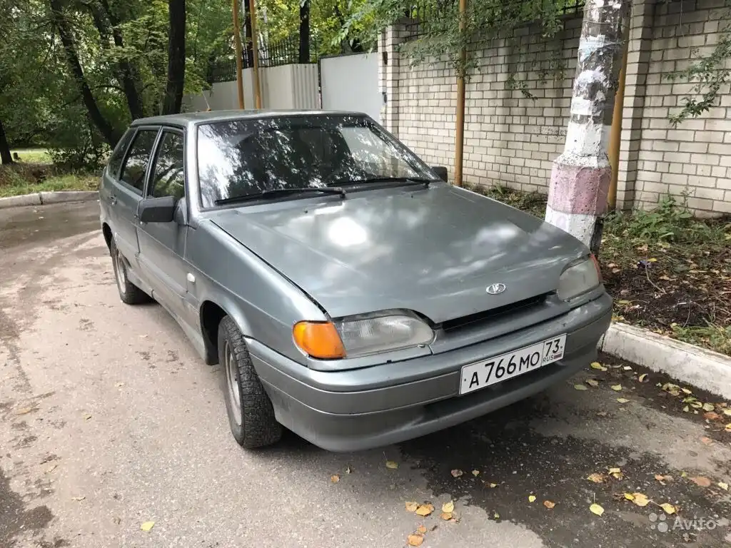 Фото автомобиля LADA 2114 SAMARA, 2005 — госномер Е100ХО73. Цвет: средний серо-зеленый металлик