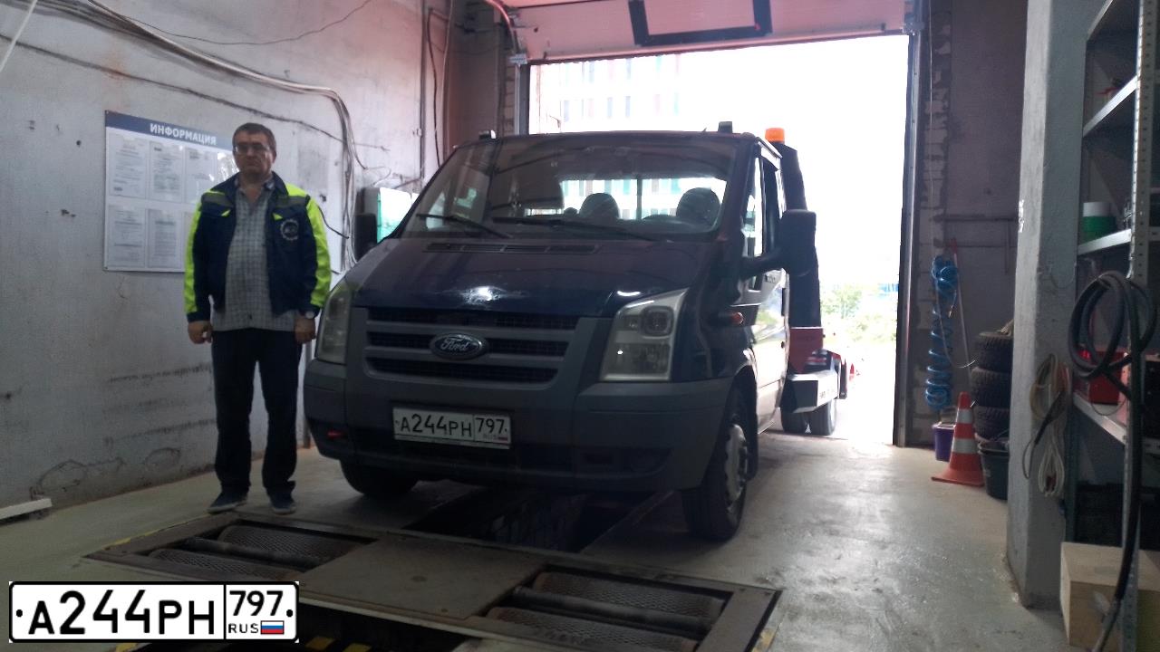 Фото автомобиля FORD TRANSIT, 2009 — госномер А244РН797. Цвет: Темно-синий
