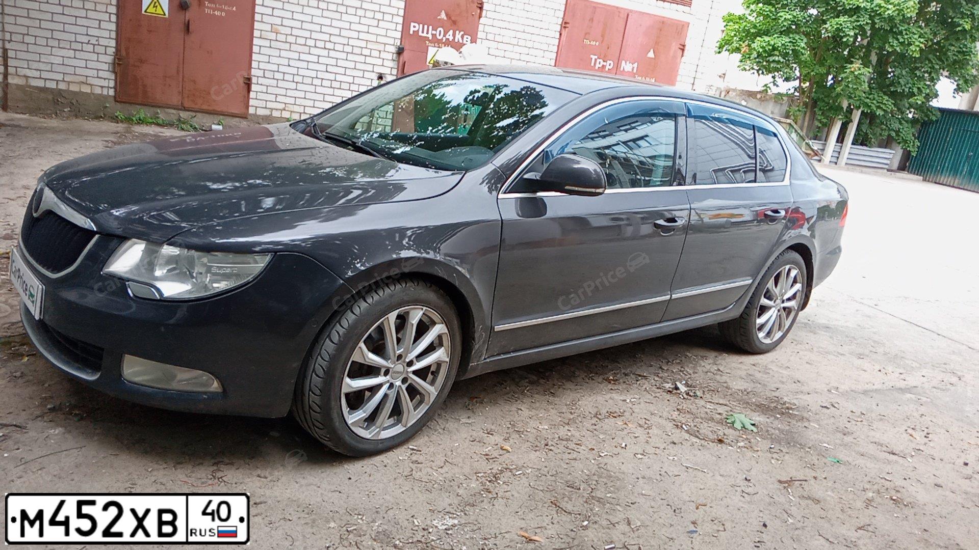 Фото автомобиля SKODA SUPERB, 2010 — госномер Н404ОТ761. Цвет: Коричневый
