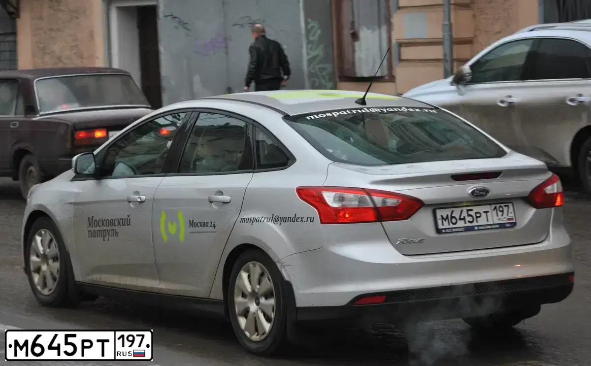 Фото автомобиля FORD FOCUS, 2011 — госномер Т323ХУ71. Цвет: СЕРЕБРИСТЫЙ