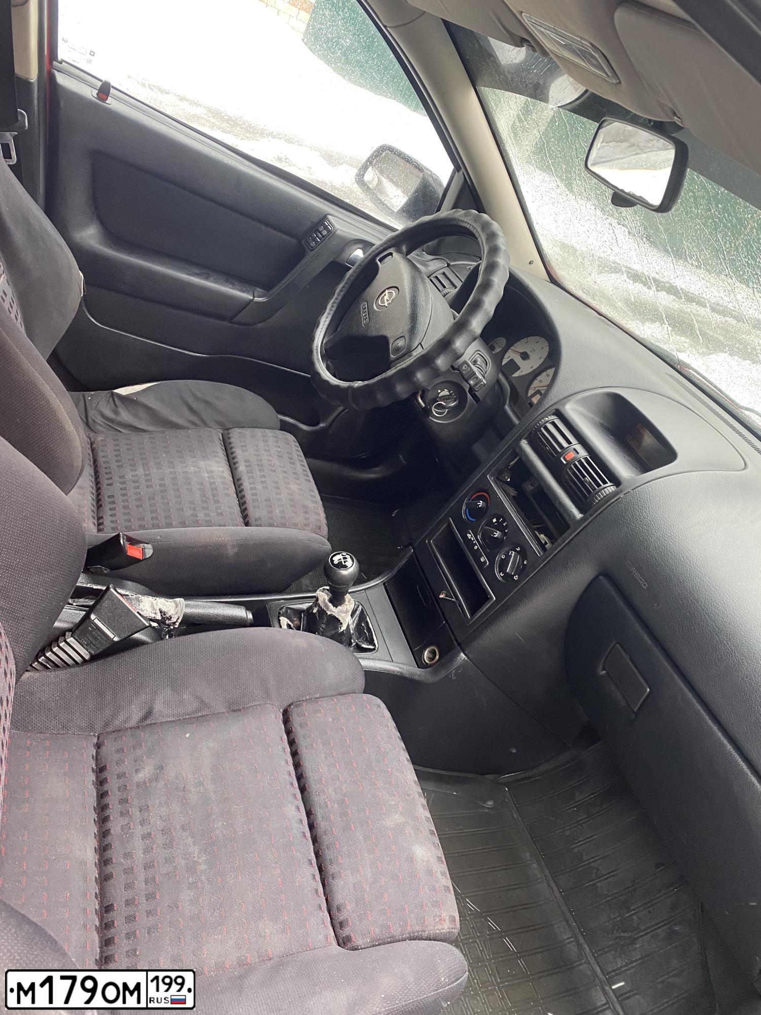 Фото автомобиля OPEL ASTRA, 1998 — госномер Н761КН98. Цвет: Красный