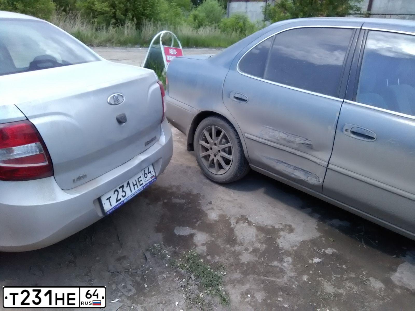 Фото автомобиля LADA 2190 GRANTA, 2013 — госномер Т231НЕ64. Цвет: СЕРЕБРИСТЫЙ