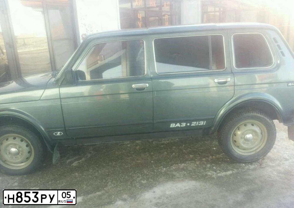 Фото автомобиля LADA 2131 NIVA, 2011 — госномер Н853РУ05. Цвет: Серо-сине-зеленый