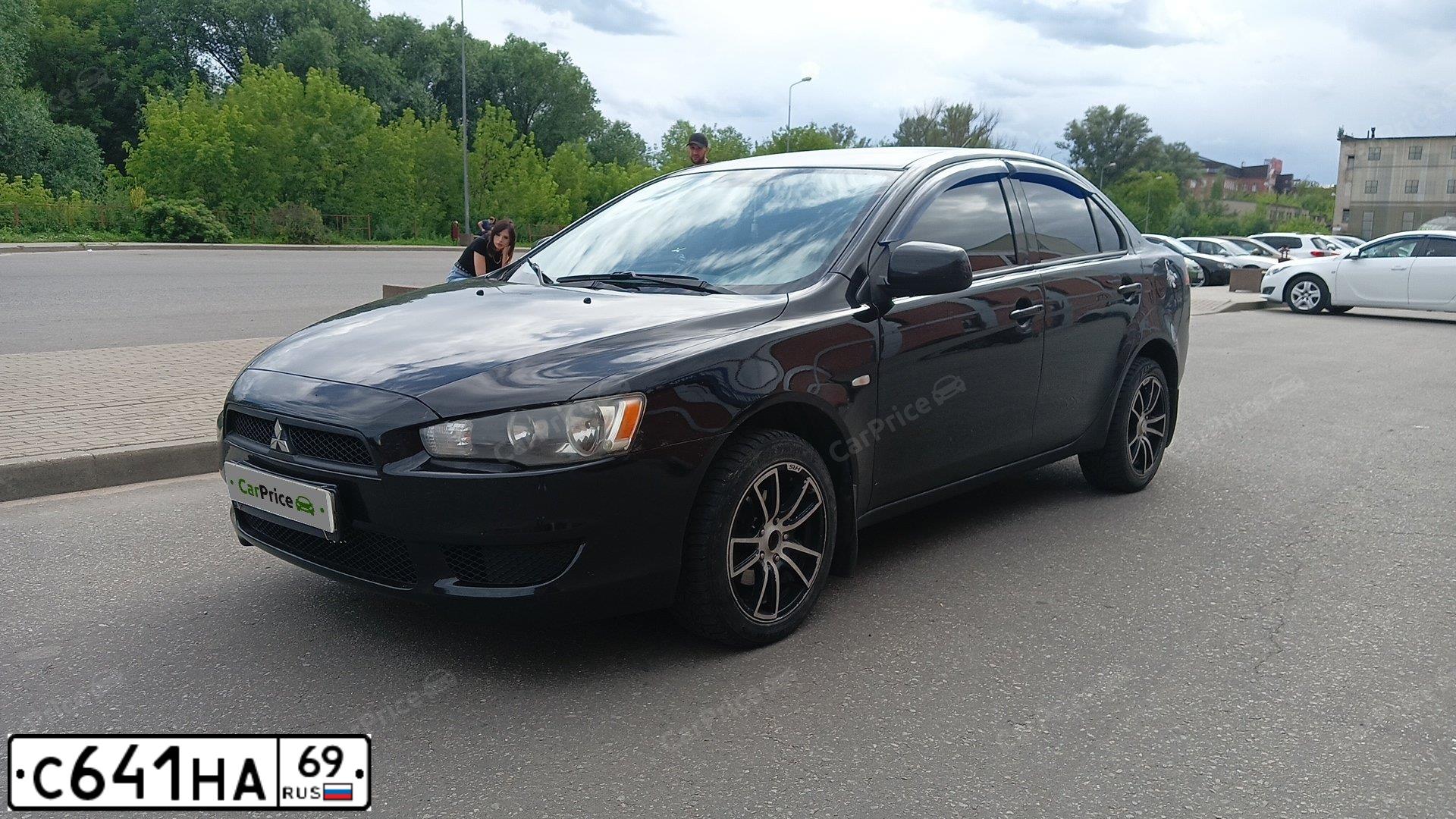 Фото автомобиля MITSUBISHI LANCER, 2008 — госномер К983АК550. Цвет: ЧЕРНЫЙ