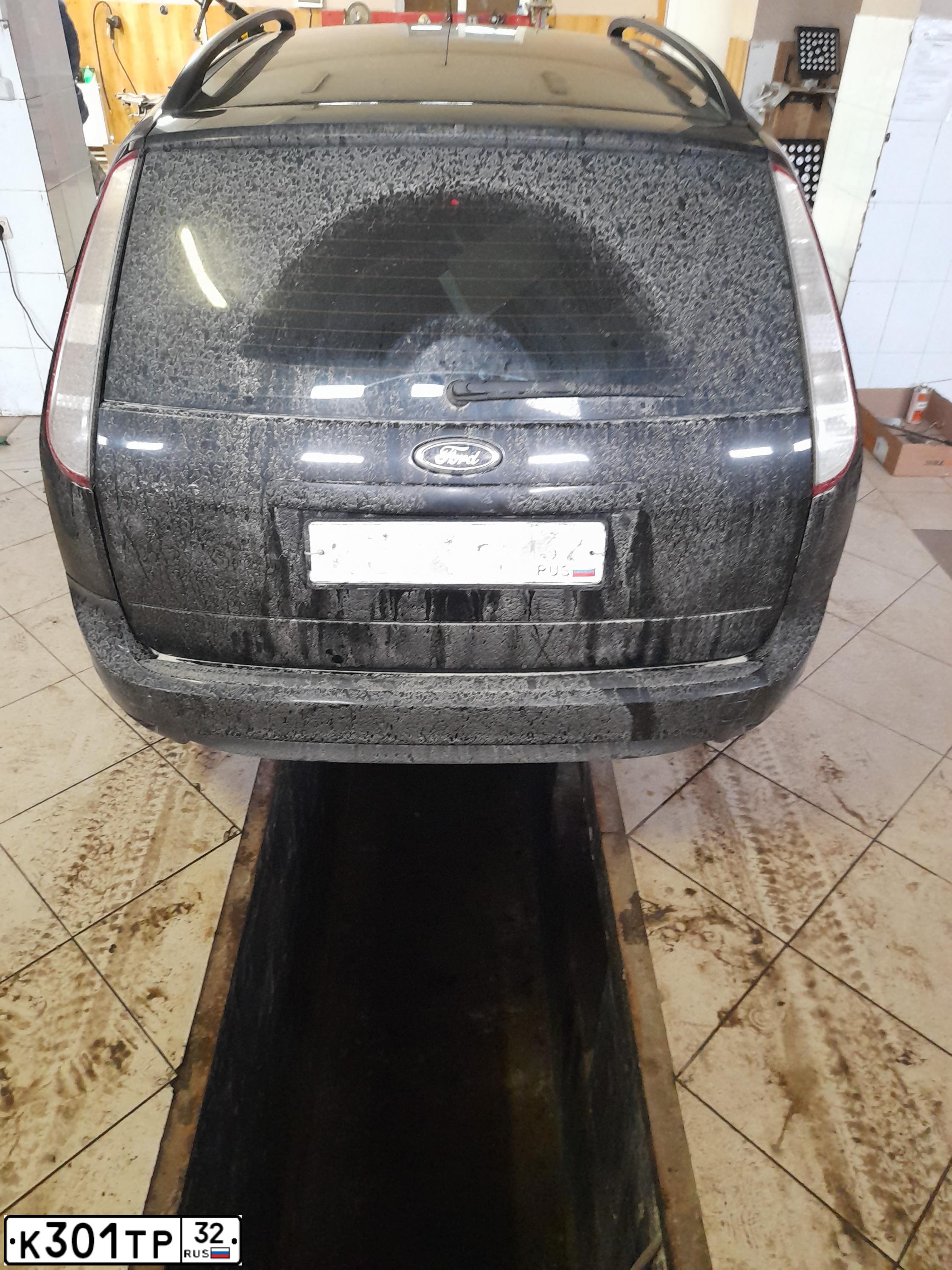 Фото автомобиля FORD FOCUS, 2010 — госномер К301ТР32. Цвет: ЧЕРНЫЙ