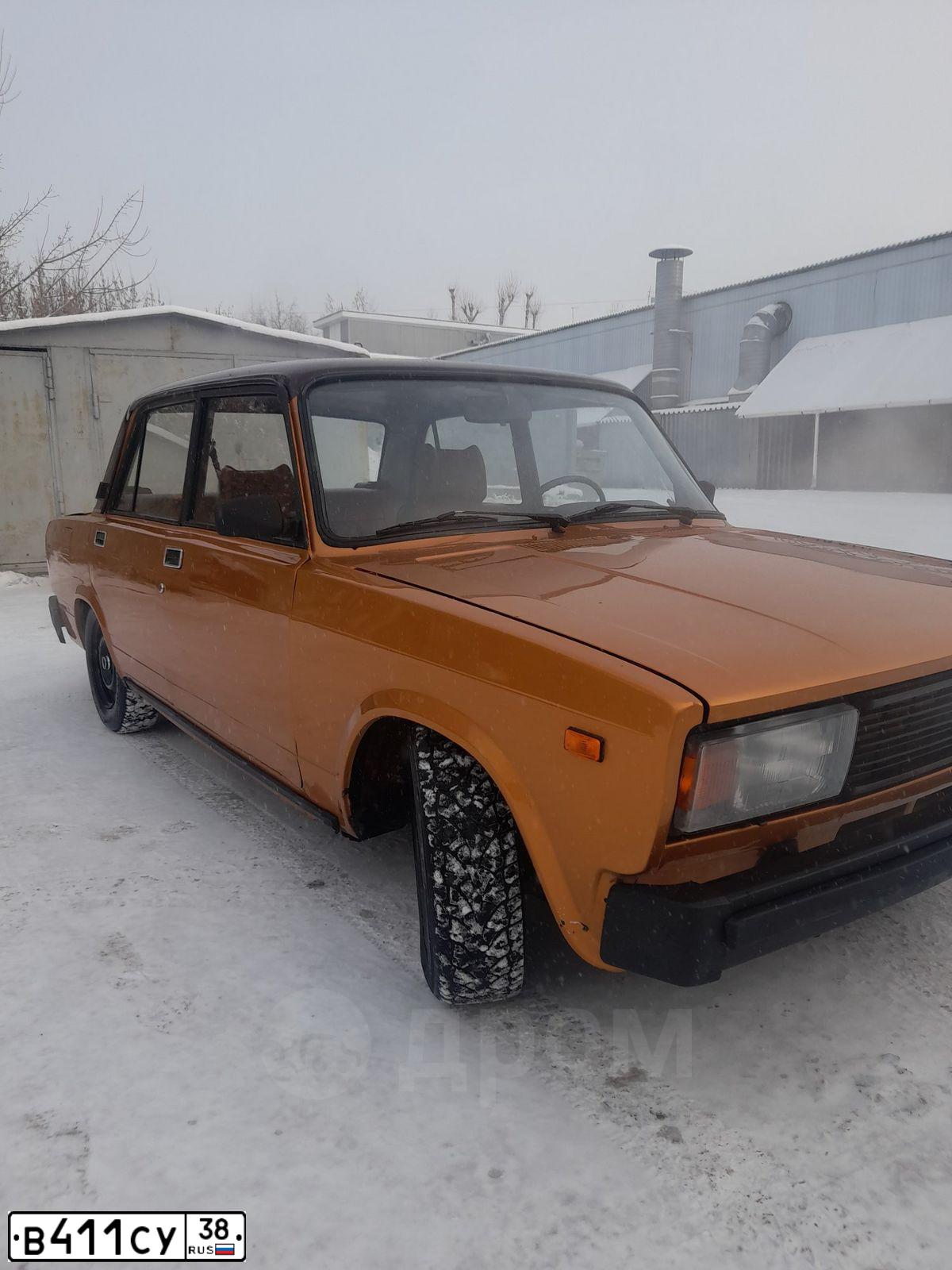 Фото автомобиля LADA 2105, 1984 — госномер В411СУ38. Цвет: ЗОЛОТИСТЫЙ